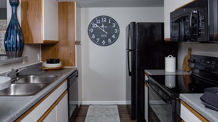 Kitchen with White Cabinets and Wood Trim