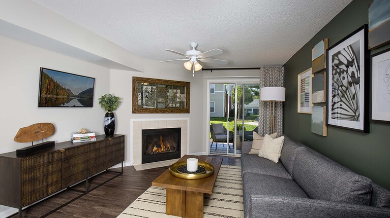 Living room with fireplace and ceiling fan